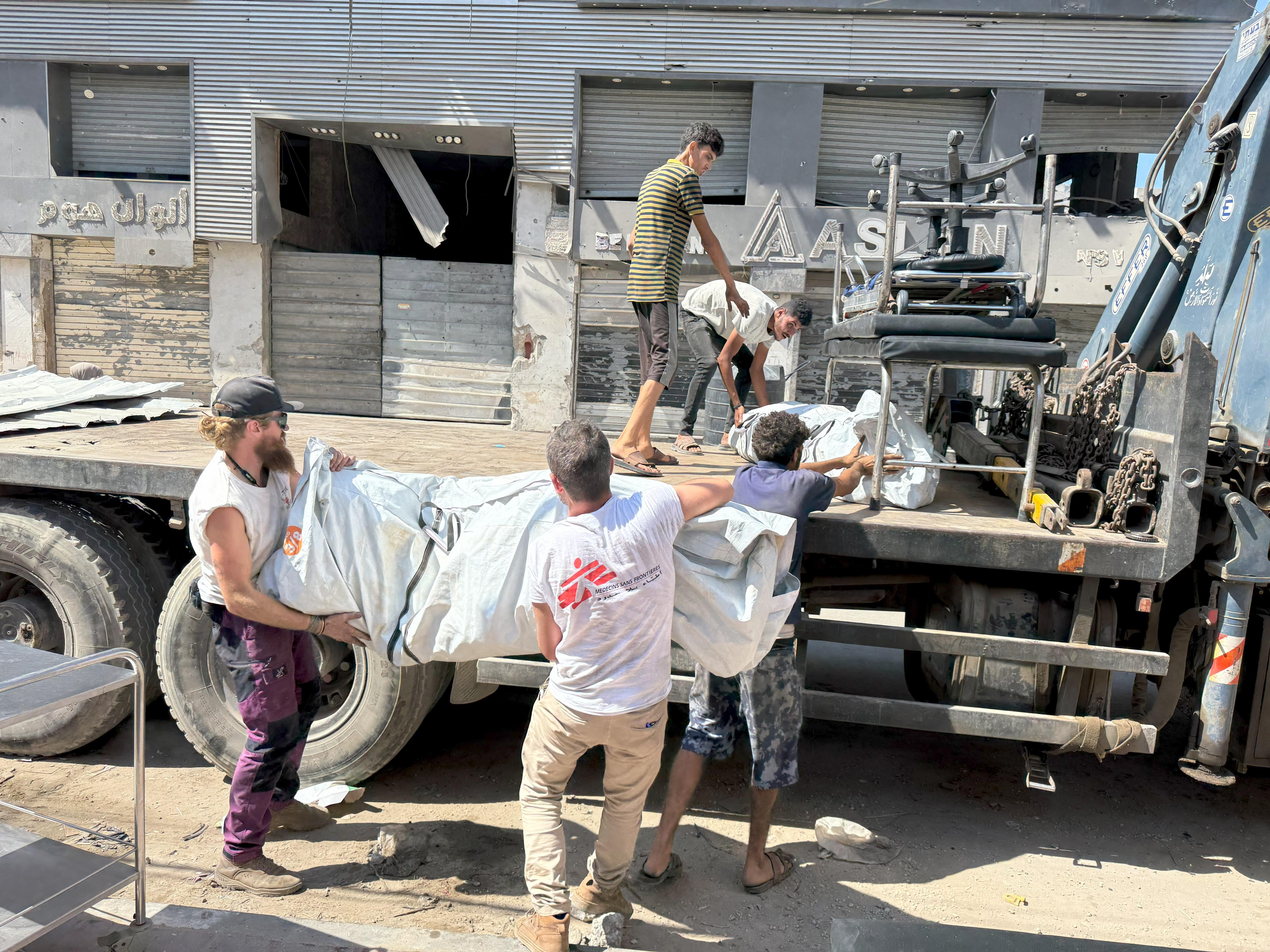 Five MEDSF staff load tents on to a truck in Gaza City